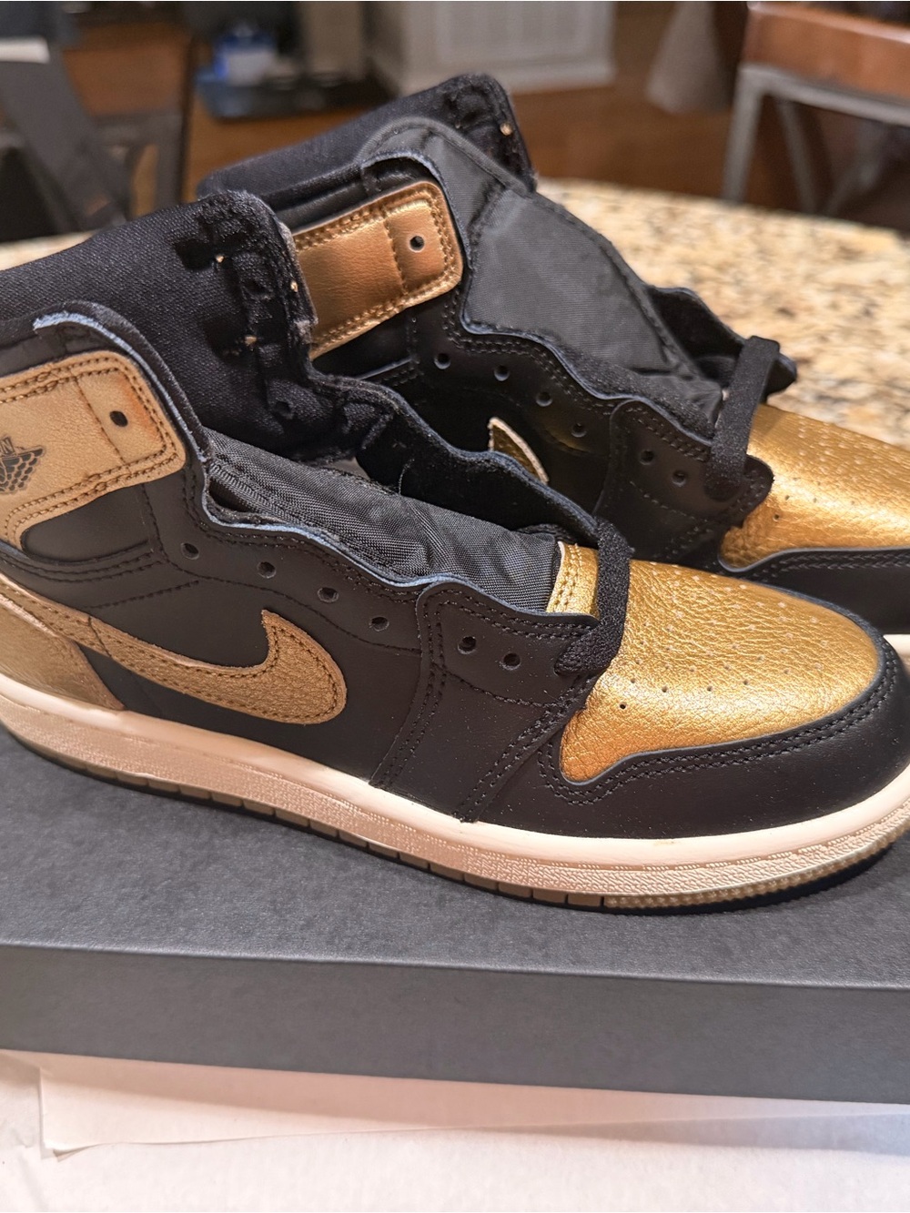 Jordan Black and Metallic Gold High-Top Sneakers
